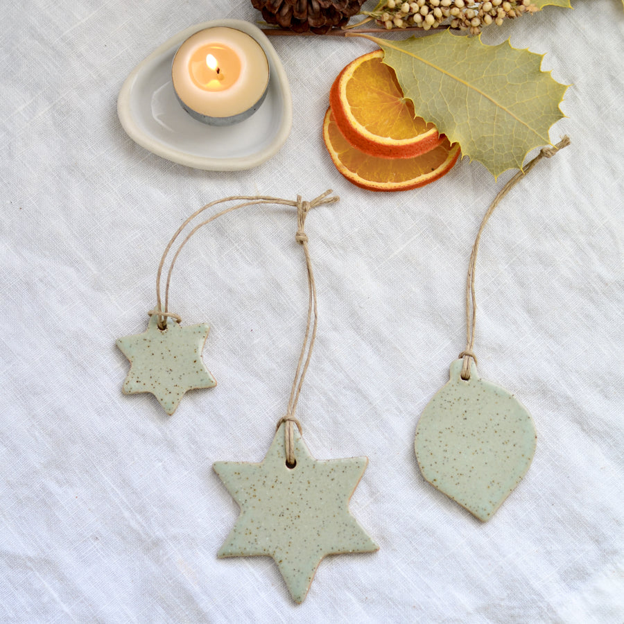 Handmade ceramic Christmas star and bauble ornaments and decorations in soft speckled green colour by Kim Wallace Ceramics Australia
