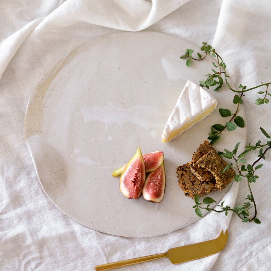 Handmade ceramic stoneware cheese board platter in natural organic shape