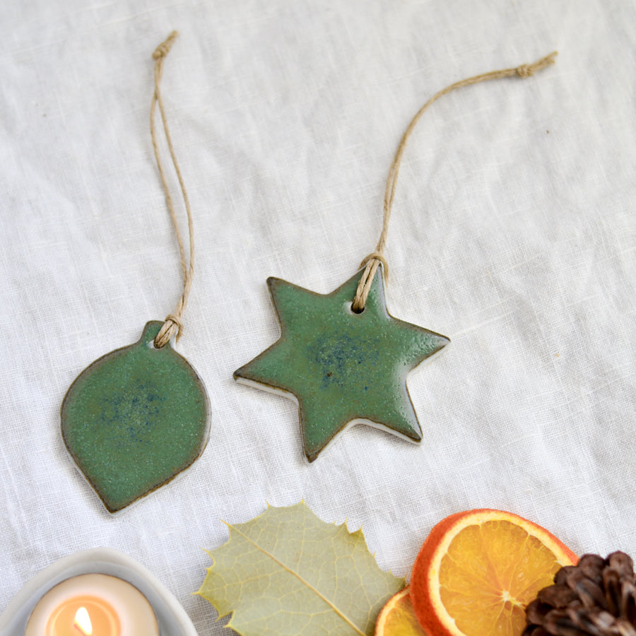 Handmade ceramic Christmas star and bauble ornaments and decorations in dark forest green by Kim Wallace Ceramics Australia