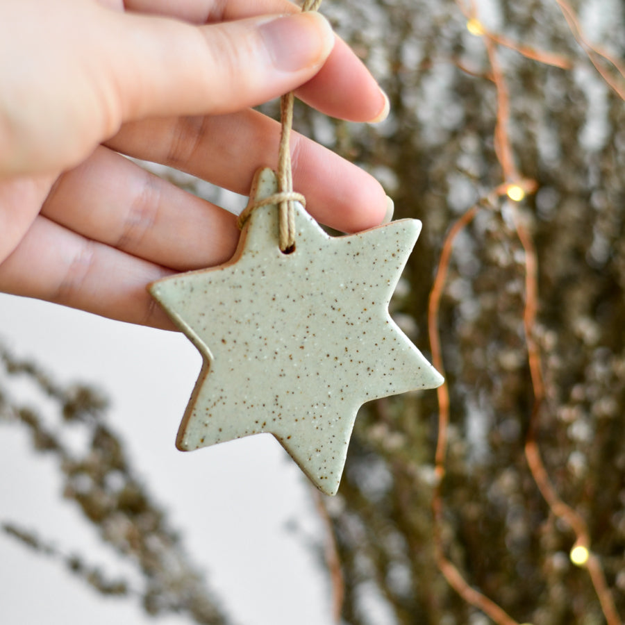 Handmade ceramic Christmas star  ornament in soft speckled green colour by Kim Wallace Ceramics Australia